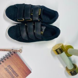 Puma black and gold velcro sneakers